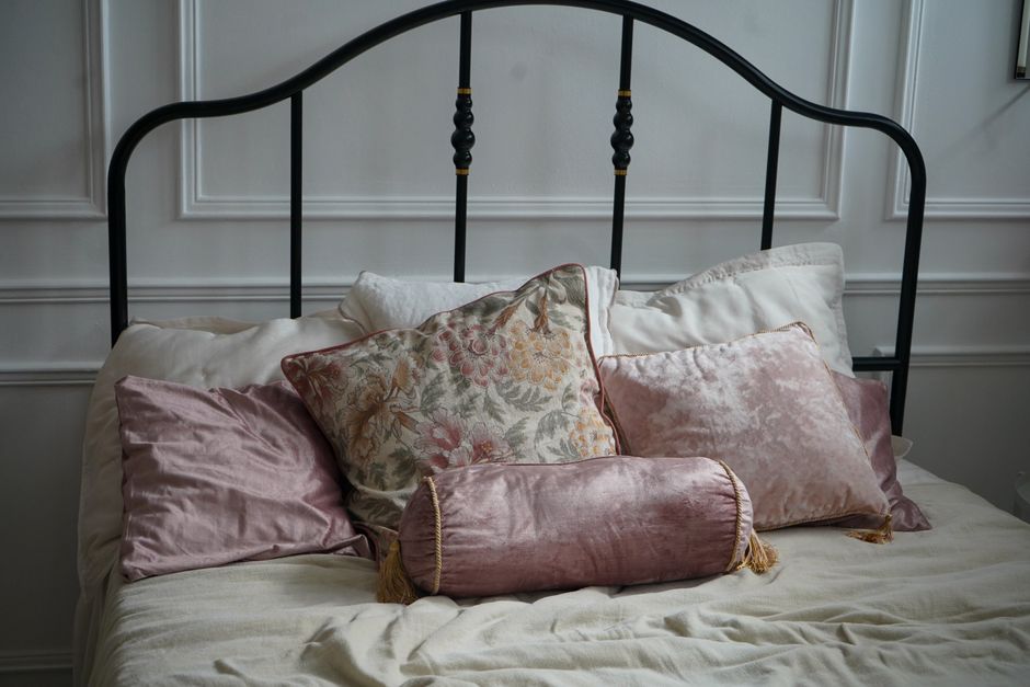 Soft pillows on a neatly made bed